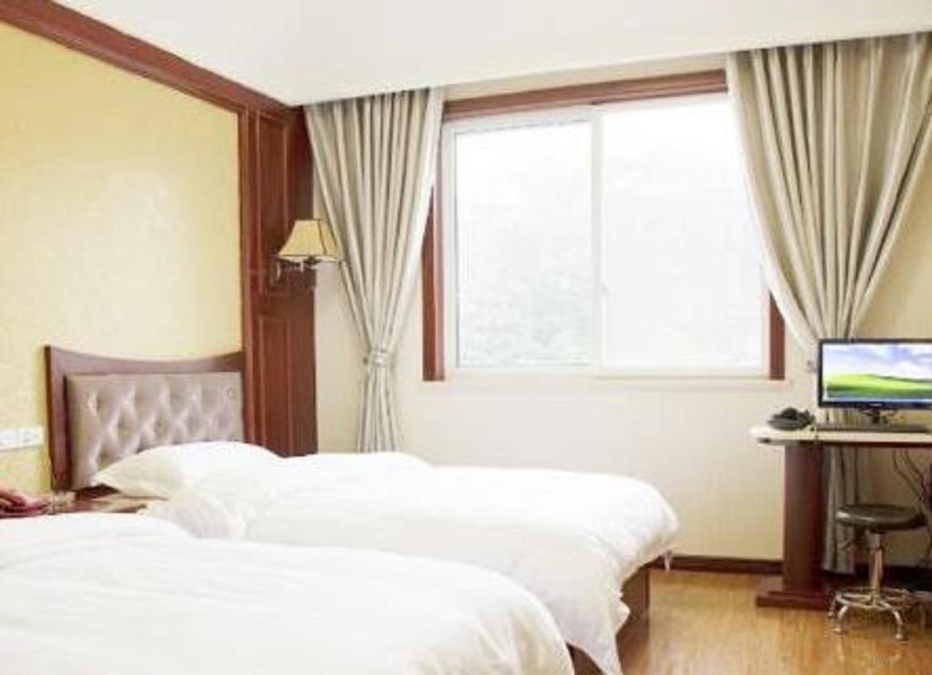 Xingzhou Hotel Leshan Chambre photo